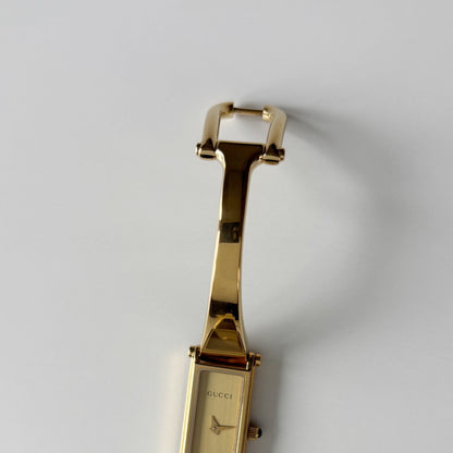 Gucci 1990s Gold Rectangular Dial Gold Plated Bangle Watch (Small)