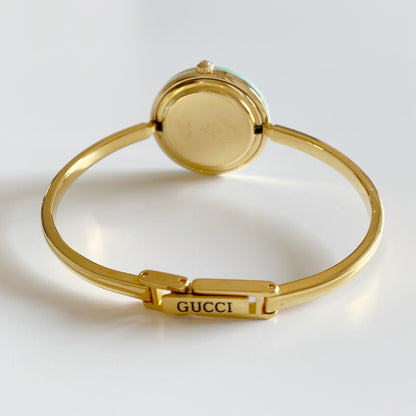 Gucci 1990s Interchangeable Bezel Gold Plated Bangle Watch with 12 bezels, case
