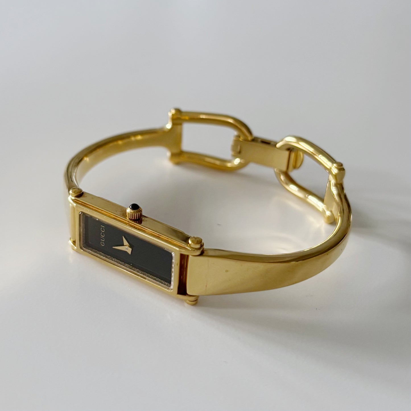 Gucci 1990s Black Dial Rectangular Gold Plated Bangle Watch