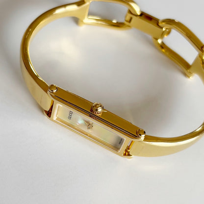 Gucci 1990s Rectangular Seashell Dial Gold Plated Bangle Watch