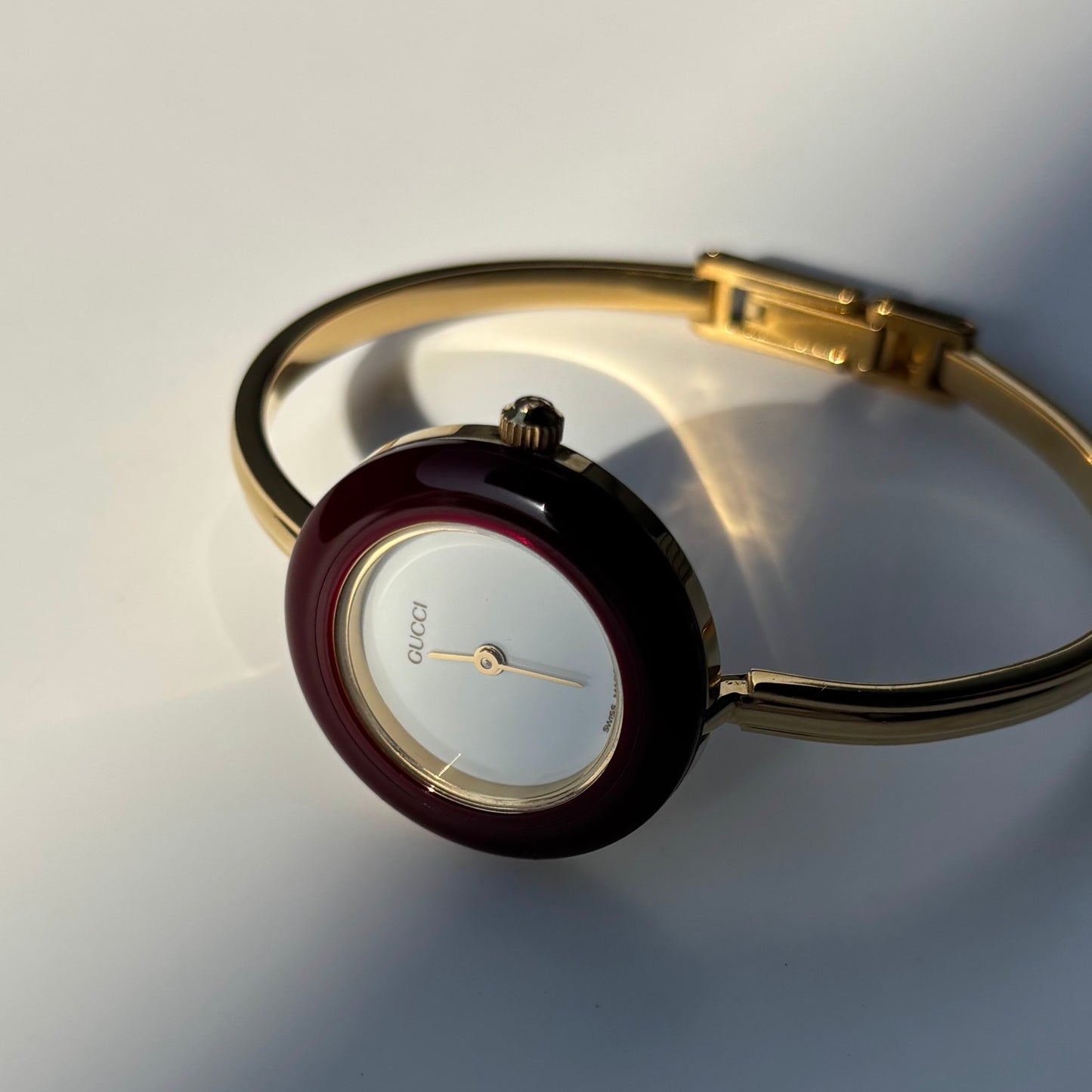 Gucci 1990s Interchangeable Bezel Gold Plated Bangle Watch with 12 bezels, case