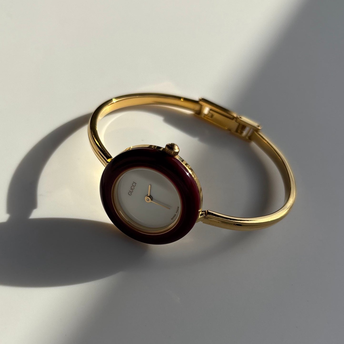 Gucci 1990s Interchangeable Bezel Gold Plated Bangle Watch with 12 bezels, case