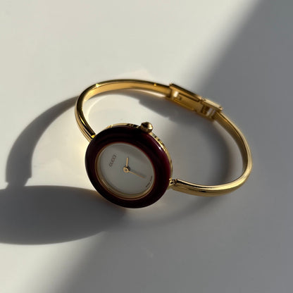 Gucci 1990s Interchangeable Bezel Gold Plated Bangle Watch with 12 bezels, case