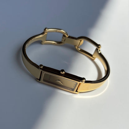 Gucci 1990s Gold Rectangular Dial Gold Plated Bangle Watch
