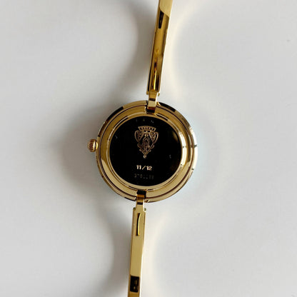 Gucci 1990s Interchangeable Bezel Gold Plated Bangle Watch with 12 bezels, case