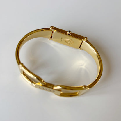 Gucci 1990s Rectangular Gold Dial Gold Plated Bangle Watch
