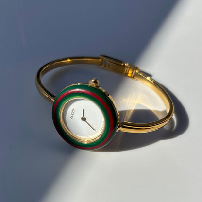 Gucci 1990s Interchangeable Bezel Gold Plated Bangle Watch with 12 bezels, case