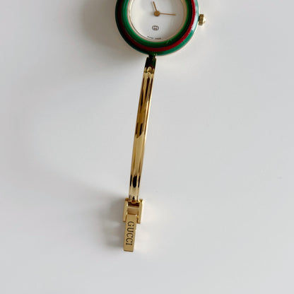 Gucci 1990s Interchangeable Bezel Gold Plated Bangle Watch with 12 bezels, case