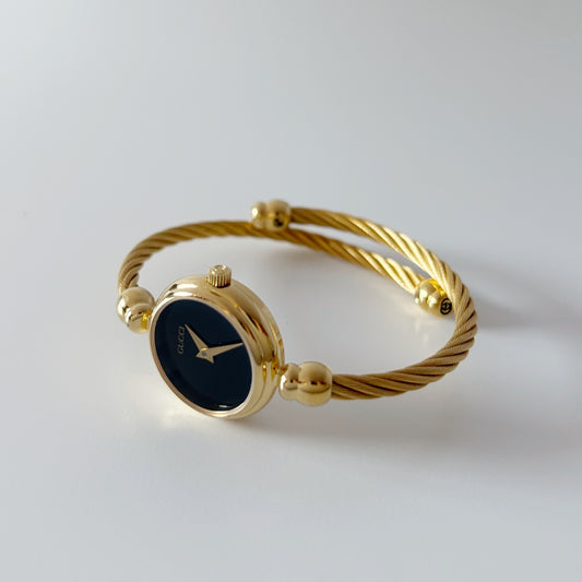 Gucci 1990s Black Dial Gold Plated Cable Bangle Watch