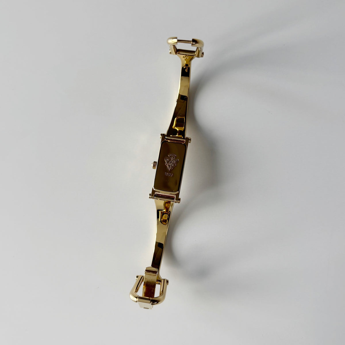 Gucci 1990s Rectangular Gold Dial Gold Plated Bangle Watch (Small)