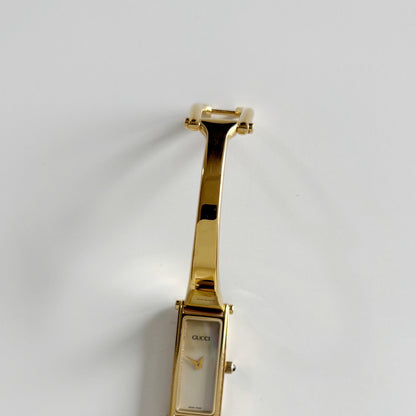 Gucci 1990s Rectangular Seashell Dial Gold Plated Bangle Watch