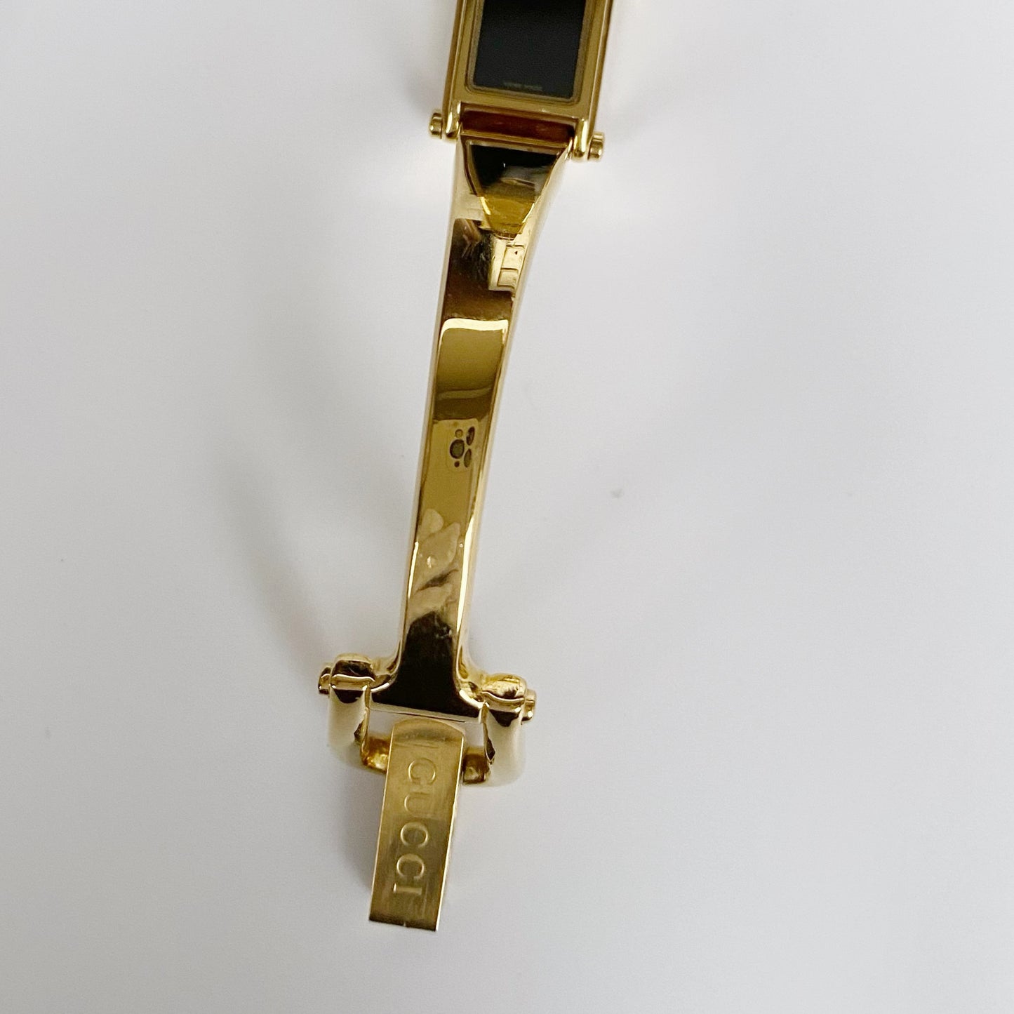 Gucci 1990s Black Dial Rectangular Gold Plated Bangle Watch