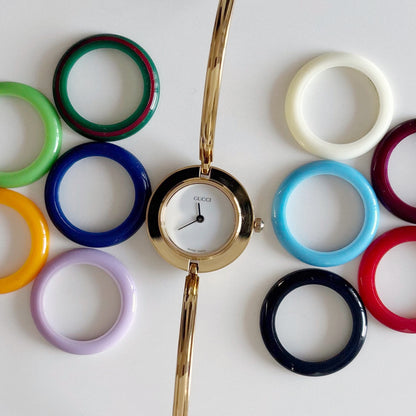 Gucci 1990s Interchangeable Bezel Gold Plated Bangle Watch with 12 bezels, case