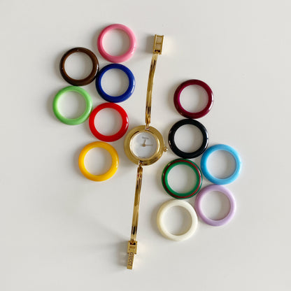 Gucci 1990s Interchangeable Bezel Gold Plated Bangle Watch with 12 bezels, case