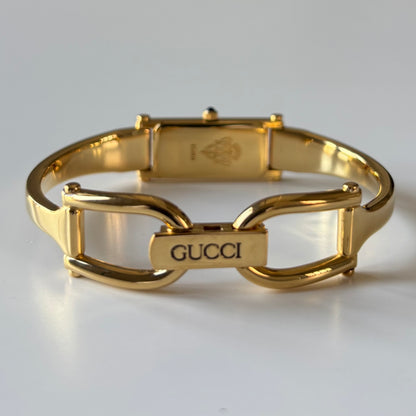 Gucci 1990s Rectangular Gold Dial Gold Plated Bangle Watch