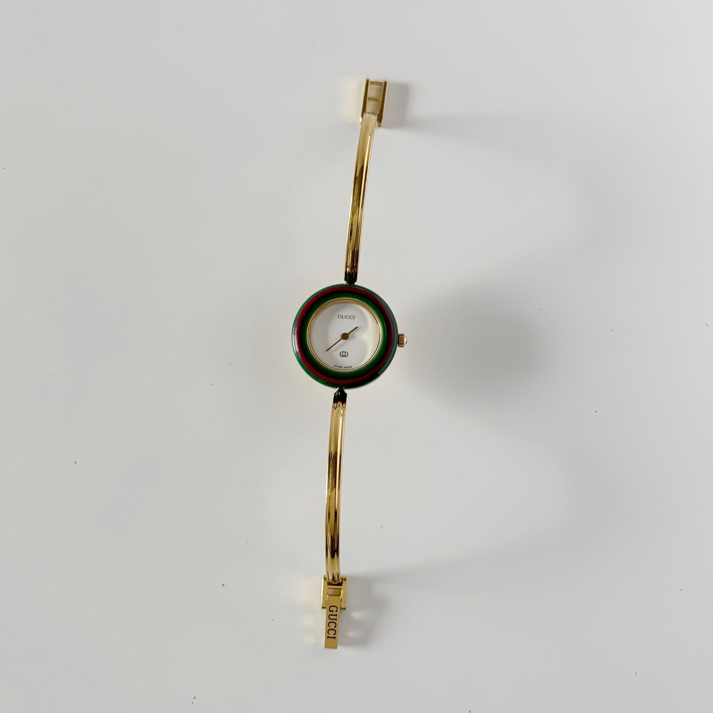 Gucci 1990s Interchangeable Bezel Gold Plated Bangle Watch with 12 bezels, case