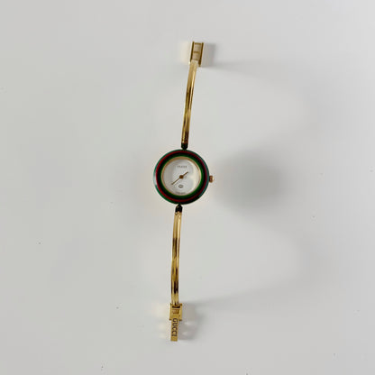 Gucci 1990s Interchangeable Bezel Gold Plated Bangle Watch with 12 bezels, case