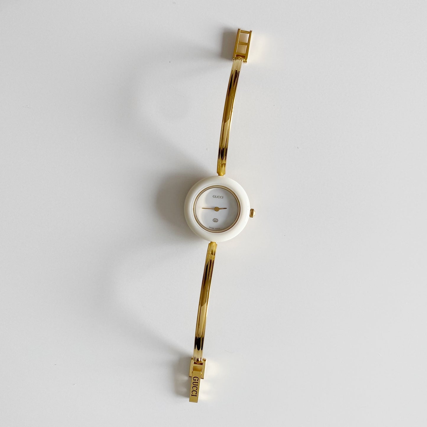 Gucci 1990s Interchangeable Bezel Gold Plated Bangle Watch with 12 bezels, case