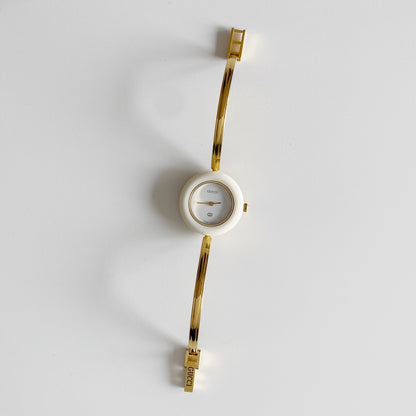 Gucci 1990s Interchangeable Bezel Gold Plated Bangle Watch with 12 bezels, case