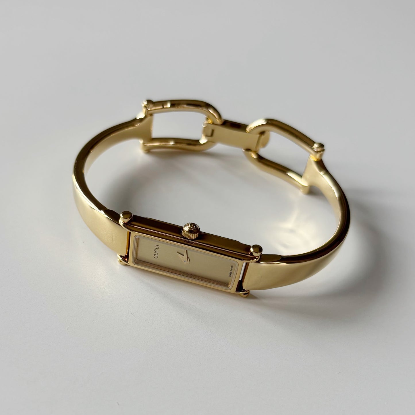Gucci 1990s Gold Rectangular Dial Gold Plated Bangle Watch