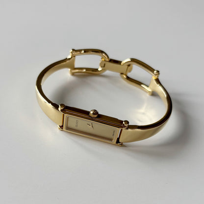 Gucci 1990s Gold Rectangular Dial Gold Plated Bangle Watch