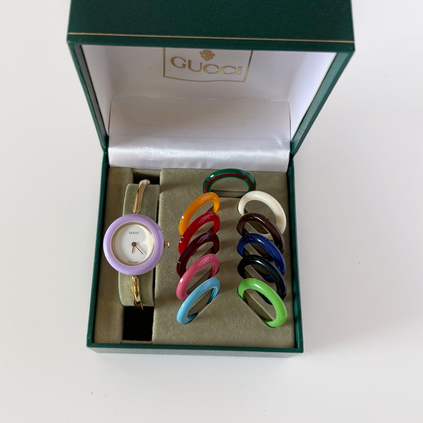 Gucci 1990s Interchangeable Bezel Gold Plated Bangle Watch with 12 bezels, case