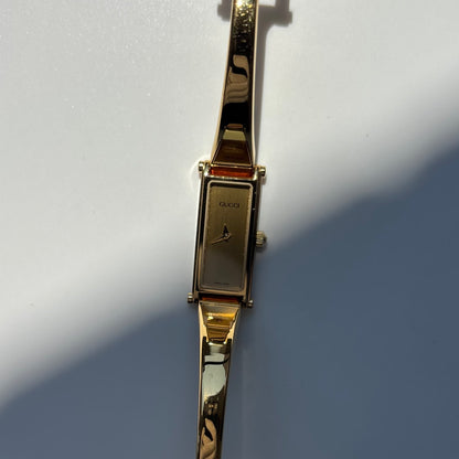Gucci 1990s Gold Rectangular Dial Gold Plated Bangle Watch