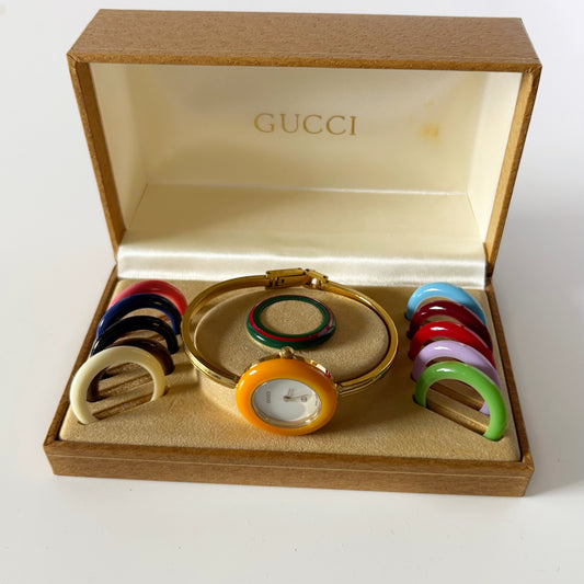 Gucci 1990s Interchangeable Bezel Gold Plated Bangle Watch with 12 bezels, case
