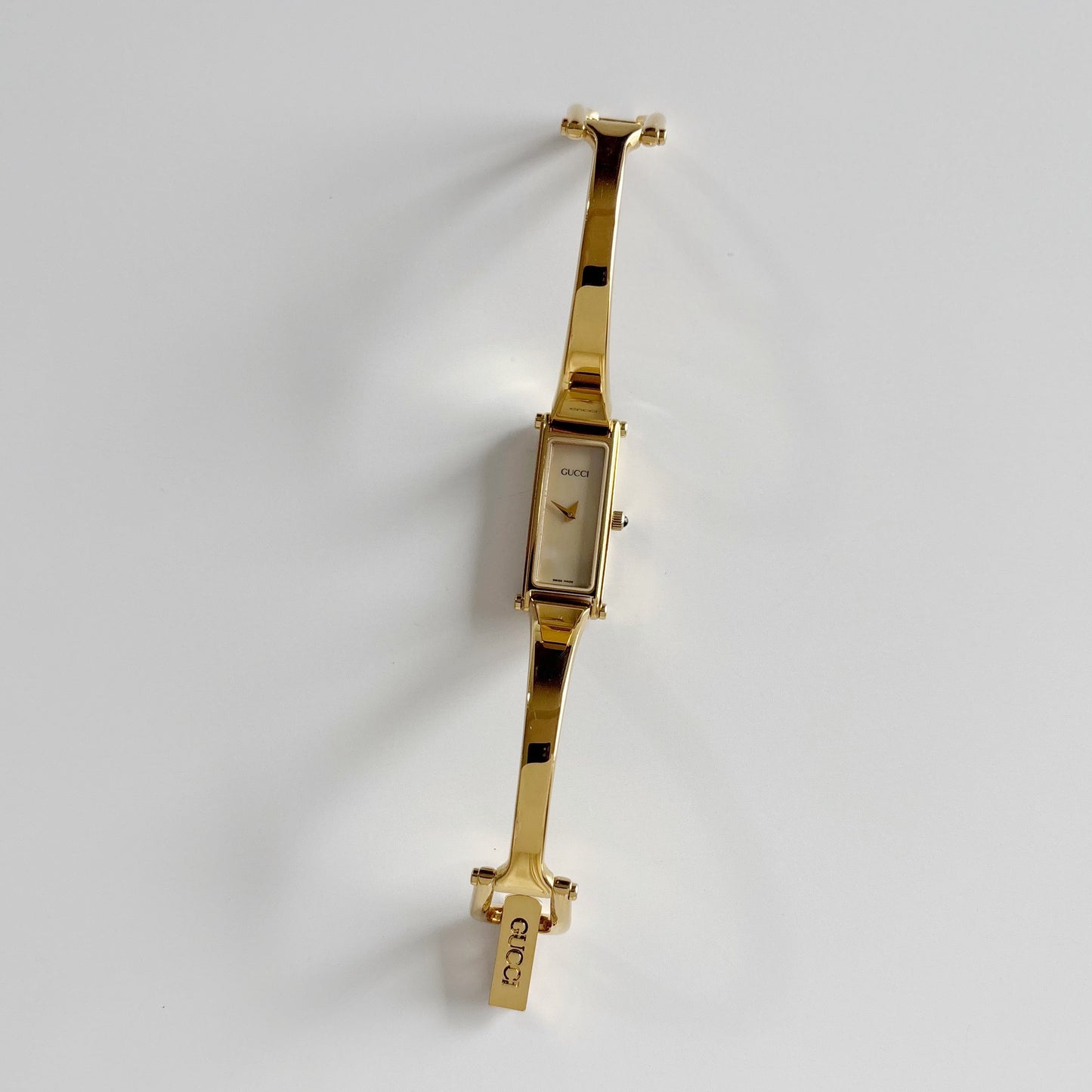 Gucci 1990s Rectangular Seashell Dial Gold Plated Bangle Watch