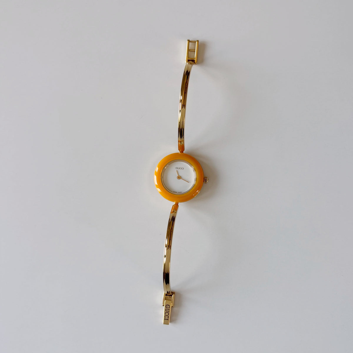 Gucci 1990s Interchangeable Bezel Gold Plated Bangle Watch with 12 bezels, case
