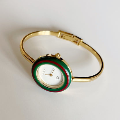 Gucci 1990s Interchangeable Bezel Gold Plated Bangle Watch with 12 bezels, case