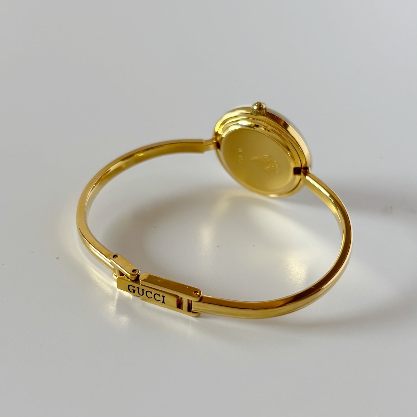 Gucci 1990s Interchangeable Bezel Gold Plated Bangle Watch with 12 bezels, case