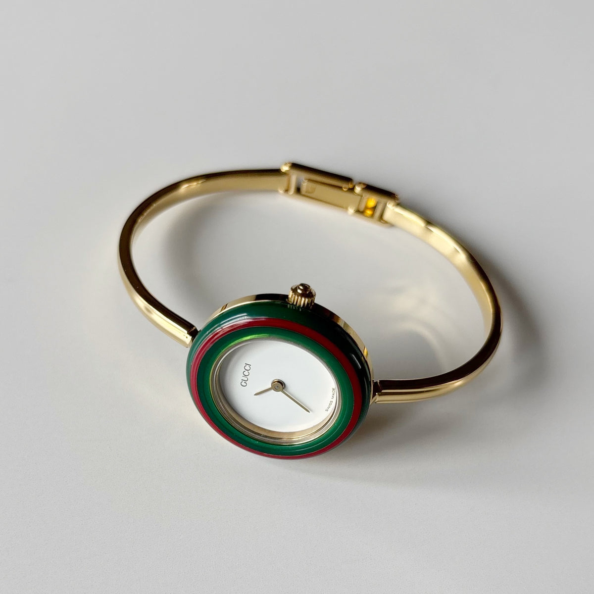 Gucci 1990s Interchangeable Bezel Gold Plated Bangle Watch with 12 bezels, case