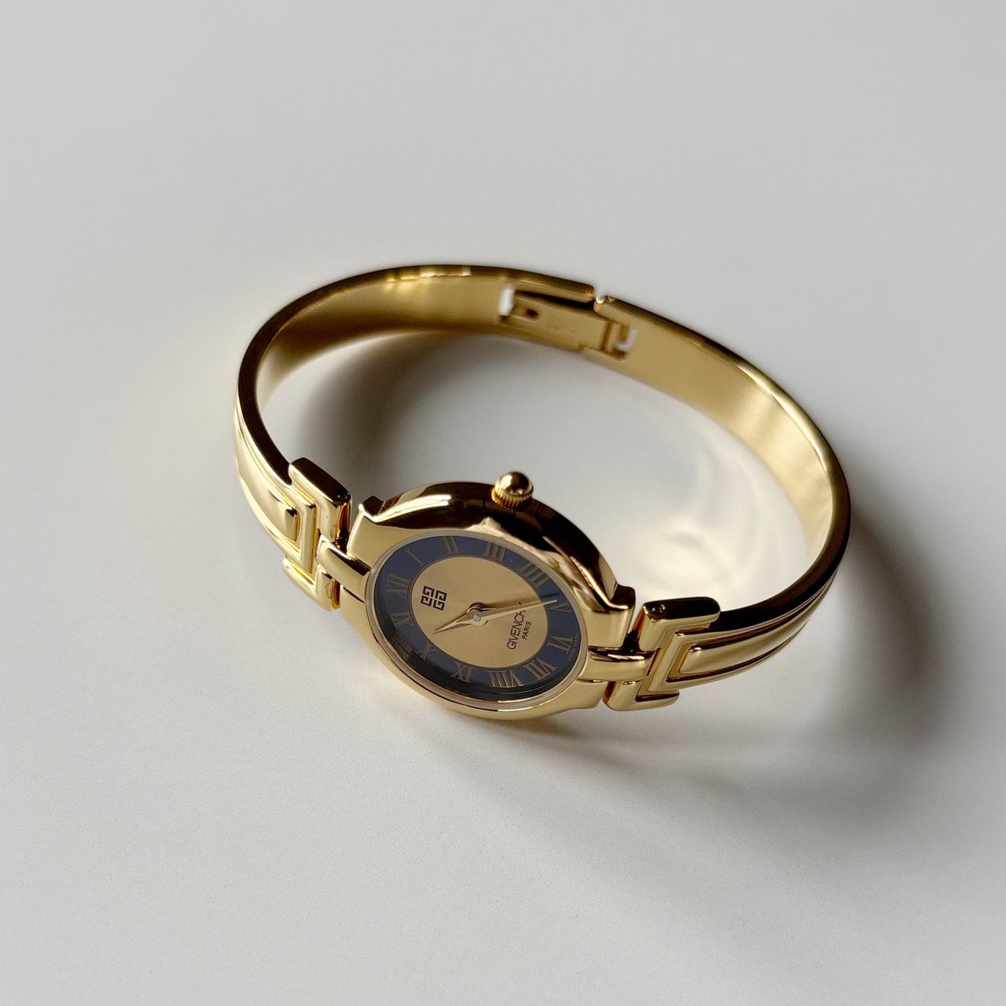 Givenchy 1990s Round Dial Gold Plated Bangle Watch