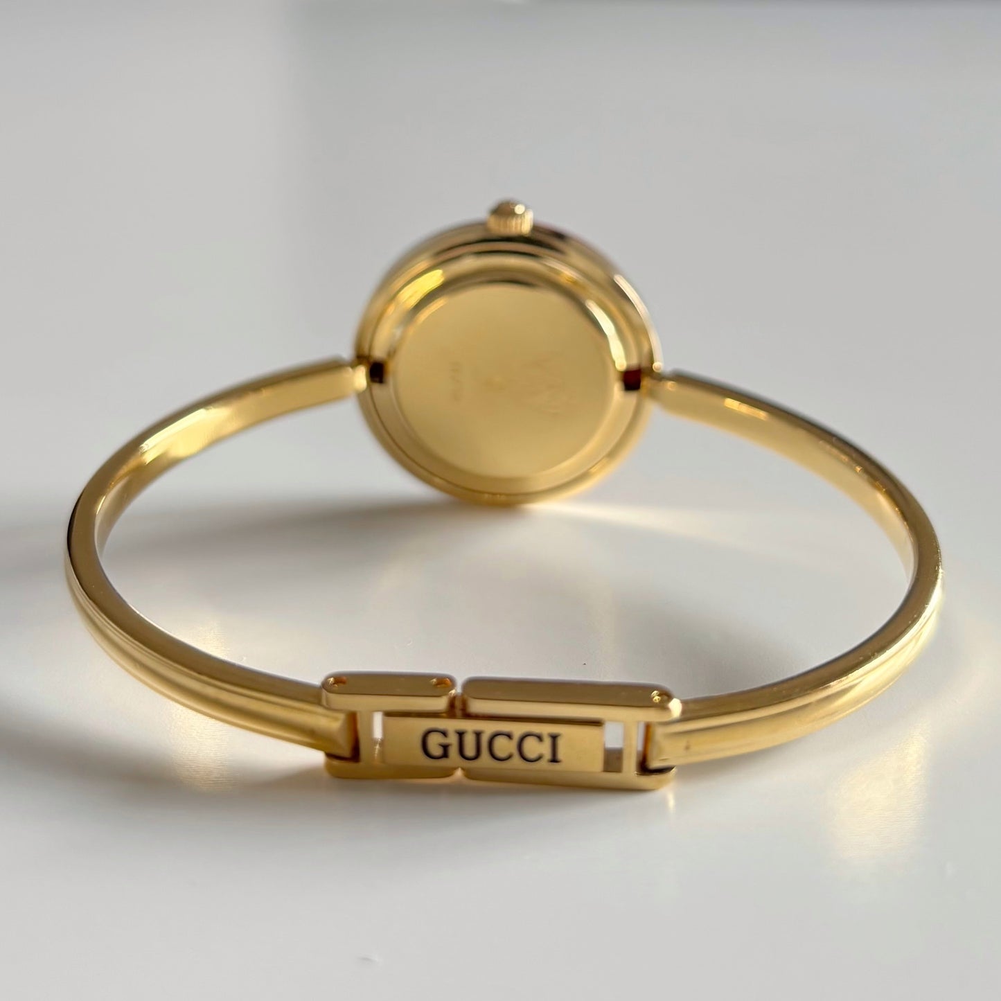 Gucci 1990s Interchangeable Bezel Gold Plated Bangle Watch with 12 bezels, case