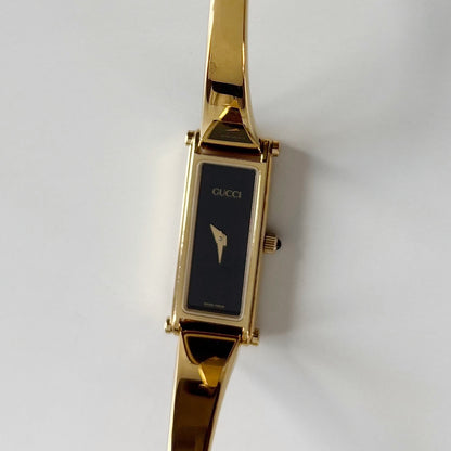Gucci 1990s Black Rectangular Dial Gold Plated Bangle Watch