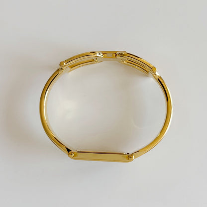 Gucci 1990s Black Dial Gold Plated Bangle Watch
