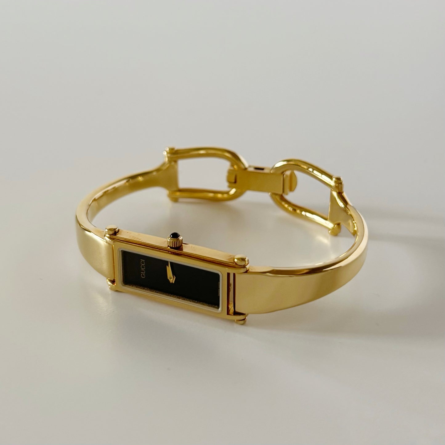 Gucci 1990s Rectangular Black Dial Gold Plated Bangle Watch