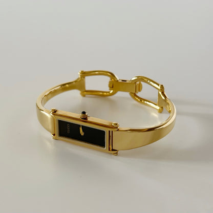 Gucci 1990s Rectangular Black Dial Gold Plated Bangle Watch