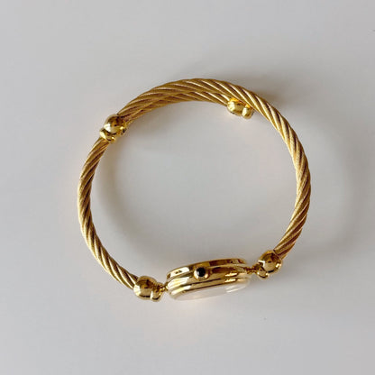 Gucci 1990s Seashell Round Dial Gold-Plated Cable Bangle Watch