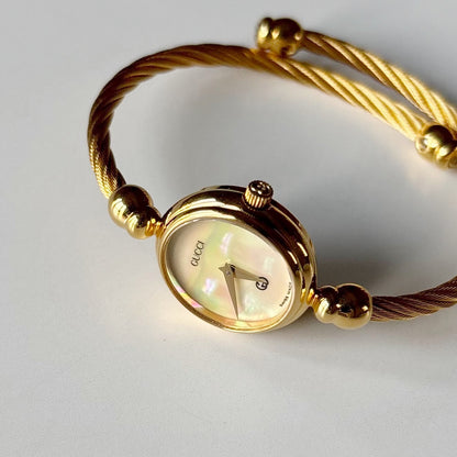 Gucci 1990s Seashell Dial Gold Plated Cable Bangle Watch