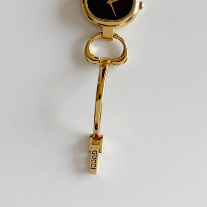 Gucci 1990s Oval Black Dial Gold Plated Bangle Watch (Small)