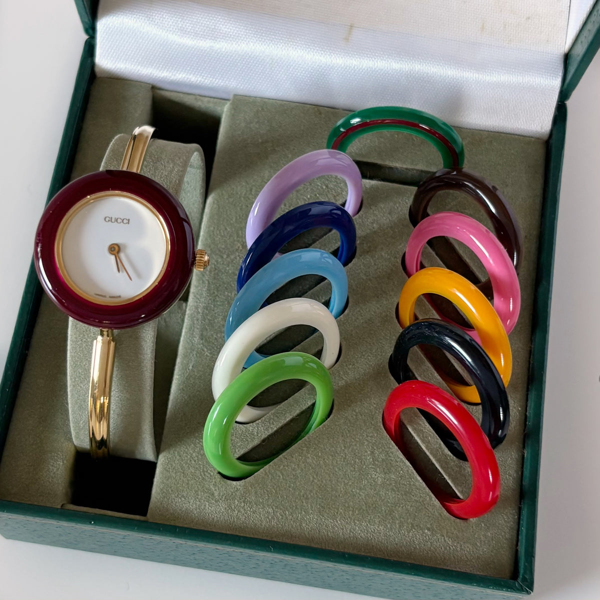 Gucci 1990s Interchangeable Bezel Gold Plated Bangle Watch with 12 bezels, case