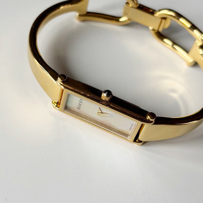 Gucci 1990s Seashell Rectangular Dial Gold Plated Bangle Watch