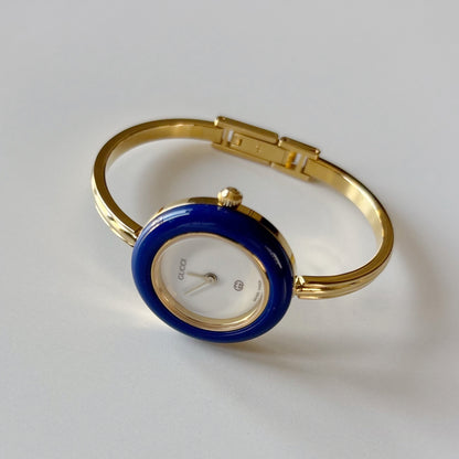 Gucci 1990s Interchangeable Bezel Gold Plated Bangle Watch with 12 bezels, case (Small)