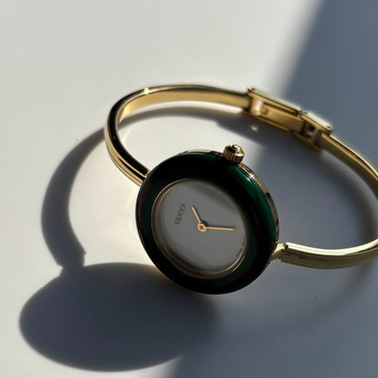 Gucci 1990s Interchangeable Bezel Gold Plated Bangle Watch with 12 bezels, case