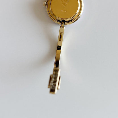 Gucci 1990s Interchangeable Bezel Gold Plated Bangle Watch with 12 bezels, case