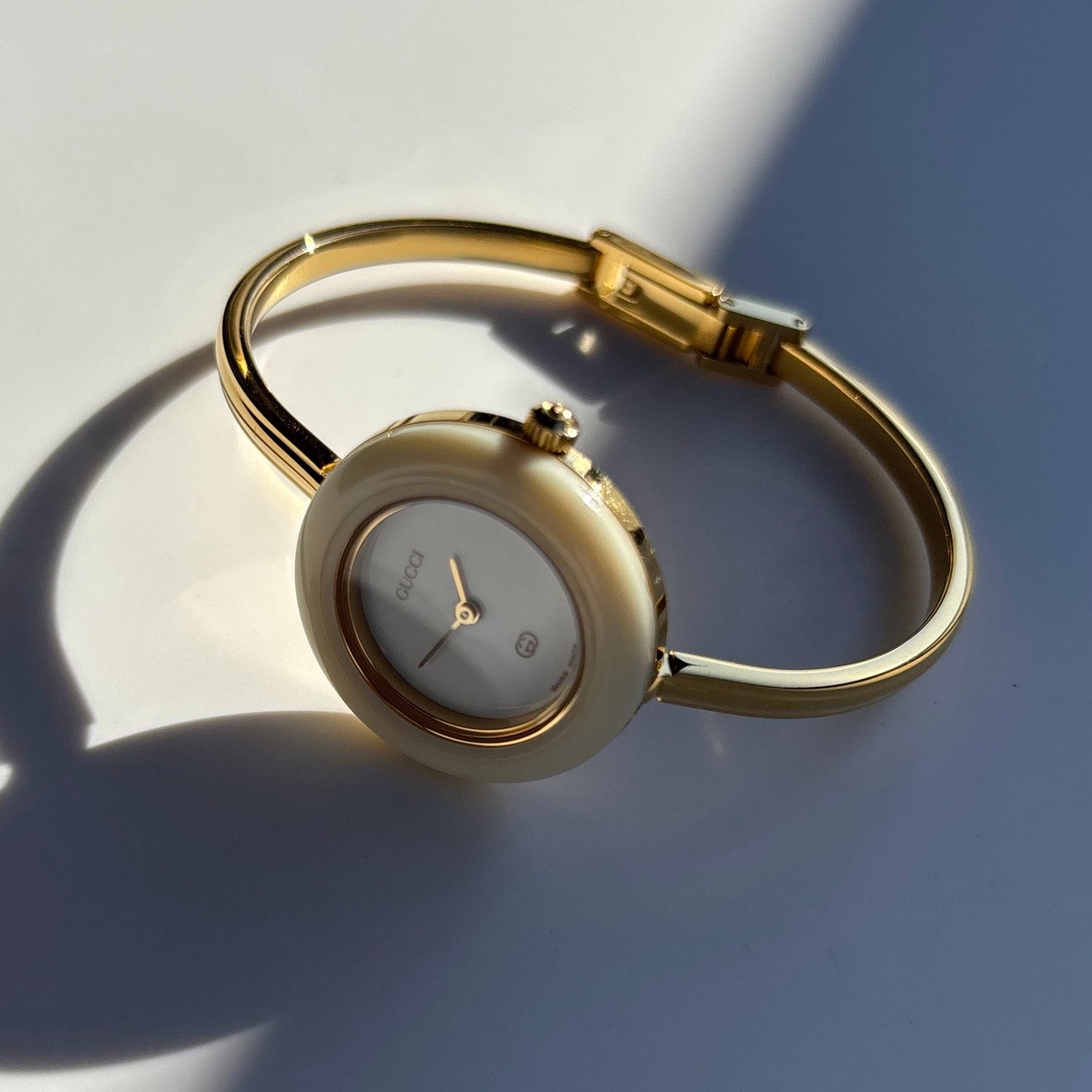 Gucci 1990s Interchangeable Bezel Gold Plated Bangle Watch with 12 bezels, case