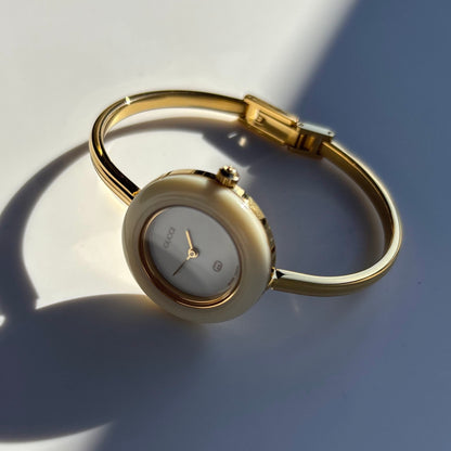 Gucci 1990s Interchangeable Bezel Gold Plated Bangle Watch with 12 bezels, case