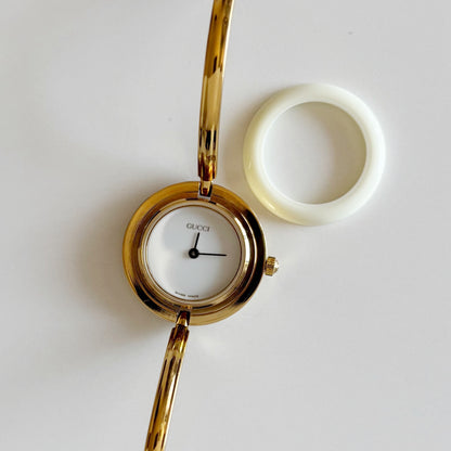 Gucci 1990s Interchangeable Bezel Gold Plated Bangle Watch with 12 bezels, case (Small)